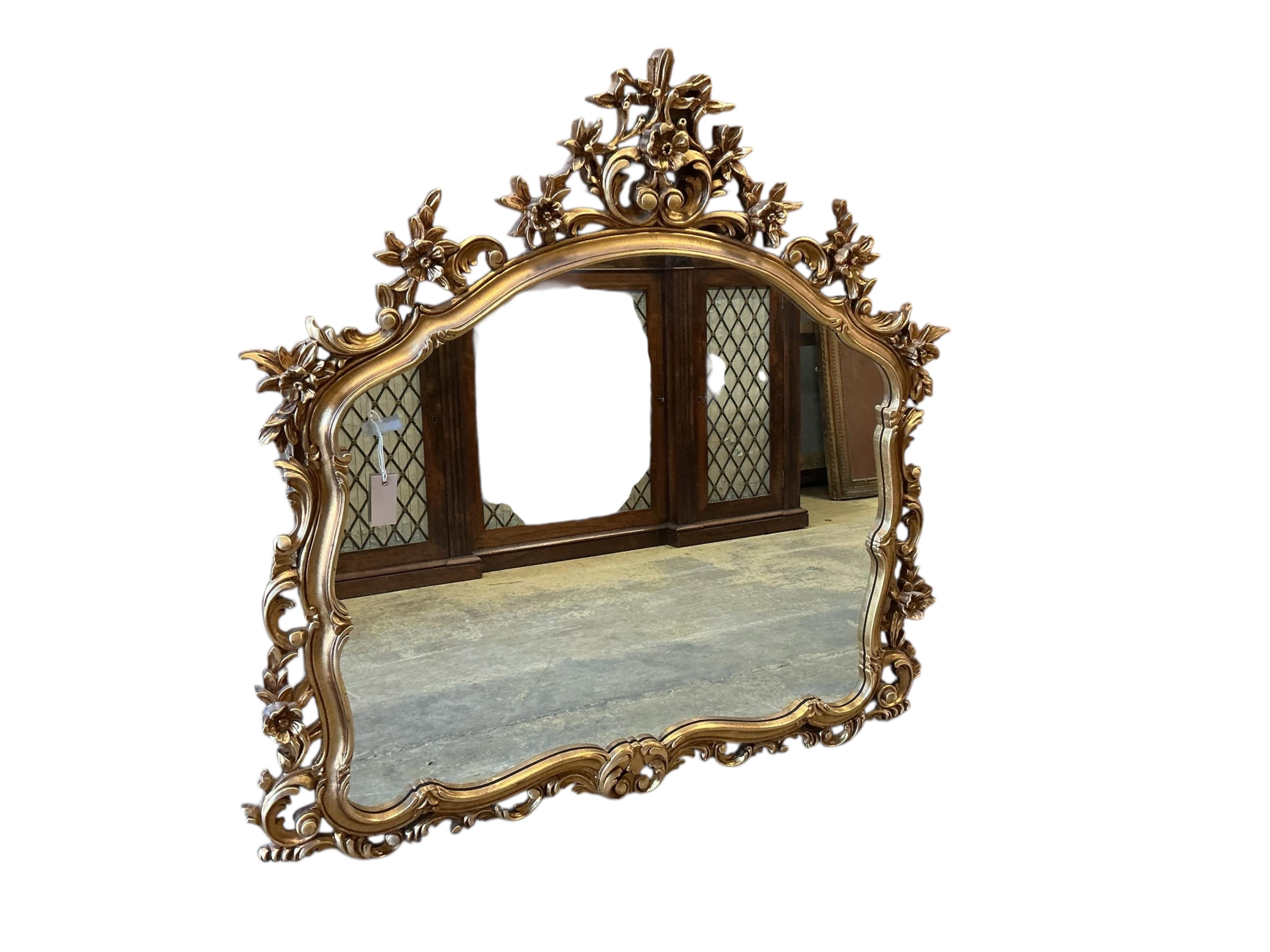 A Victorian style gilt composition wall mirror, width 114cm, height 116cm